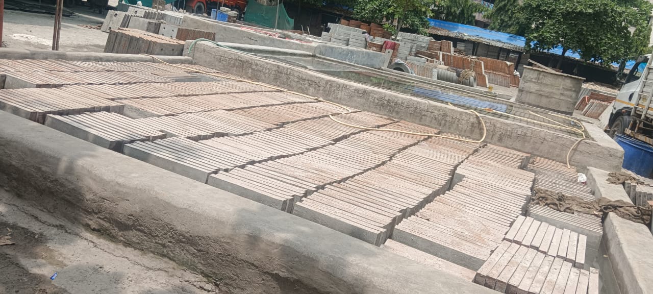 New RCC road under construction with machinery, Workers laying reinforced concrete for road making, RCC road construction site in progress, Concrete road being built using RCC method