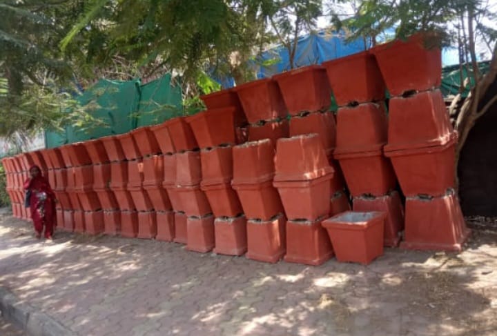 RCC Concrete Covers in Bulk, Stack of RCC concrete cover slabs stored in bulk for drainage use, Bulk quantity of reinforced concrete covers with ventilation slots, Multiple RCC concrete drain covers arranged for bulk supply, Precast RCC covers stored in large quantities at construction site